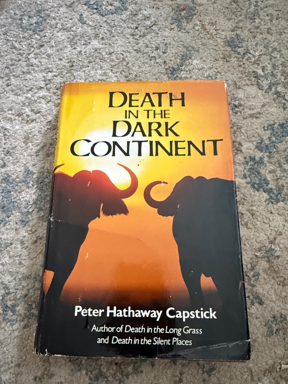 Death in the Dark Continent by Péter Hathaway Capstick - Orange & Black Cover